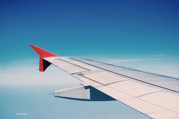 white and red airplane wing
